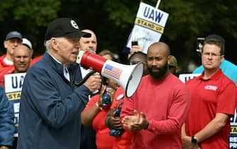 US President Joe Biden addresses a UAW picket line at a General Motors Service Parts Operations plant in Belleville, Michigan, on September 26, 2023. Some 5,600 members of the UAW walked out of 38 US parts and distribution centers at General Motors and Stellantis at noon September 22, 2023, adding to last week's dramatic worker walkout. According to the White House, Biden is the first sitting president to join a picket line. (Photo by Jim WATSON / AFP) (Photo by JIM WATSON/AFP via Getty Images)