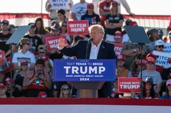 Former US President Donald Trump speaks at a campaign event in Waco, Texas, US, on Saturday, March 25, 2023. A defiant Trump railed against the investigations he faces and predicted hed prevail during a rally in Waco that may be the former presidents last public appearance before he faces potential criminal charges. Photographer: Sergio Flores/Bloomberg via Getty Images