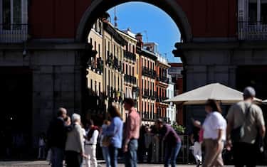 Pedestrians walk at the Plaza Mayor, in the centre of Madrid, on April 12, 2024. (Photo by Thomas COEX / AFP) (Photo by THOMAS COEX/AFP via Getty Images)