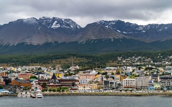 Elevated view of Ushuaia the capital of Tierra del Fuego, Antartida e Islas del Atlantico Sur Province, Argentina. Cityscape with the harbour