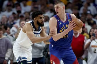 DENVER, COLORADO - APRIL 16: Nikola Jokic #15 of the Denver Nuggets is guarded by Karl-Anthony Towns #32 of the Minnesota Timberwolves in the first quarter during Round 1 Game 1 of the NBA Playoffs at Ball Arena on April 16, 2023 in Denver, Colorado. NOTE TO USER: User expressly acknowledges and agrees that, by downloading and/or using this photograph, User is consenting to the terms and conditions of the Getty Images License Agreement. (Photo by Matthew Stockman/Getty Images)