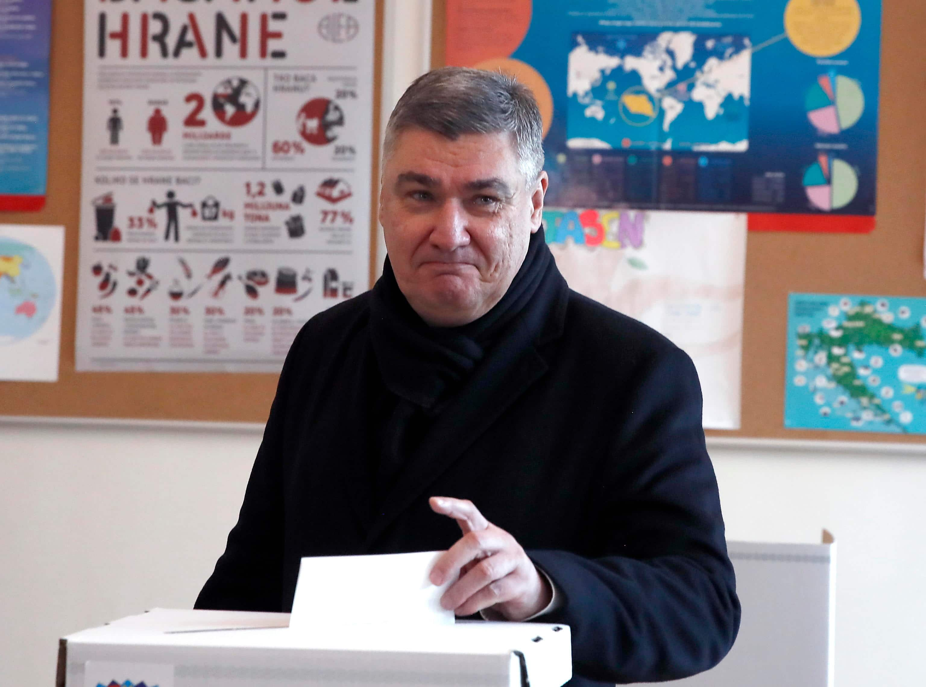 epa11797163 Presidential candidate and incumbent President of Croatia Zoran Milanovic casts his ballot during the first round of presidential elections in Zagreb, Croatia, 29 December 2024. Croatia's eighth presidential election began on 29 December, featuring eight candidates vying for a five-year term under a two-round voting system. An absolute majority is needed to win in the first round.  EPA/ANTONIO BAT