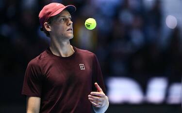 Italy's Jannik Sinner plays with the ball during the men's single final match against Spain's Carlos Alcaraz at the ATP Finals tennis tournament, in Turin, on November 16, 2025. (Photo by Marco BERTORELLO / AFP)