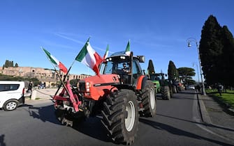Farmers gather with their tractors at Circo Massimo during a protest to ask for better working conditions on February 15, 2024. Farmers staged demonstrations for weeks all around Italy to demand lower fuel taxes, better prices for their products and an easing of EU environmental regulations that they say makes it more difficult to compete with cheaper foreign produce. (Photo by Tiziana FABI / AFP)