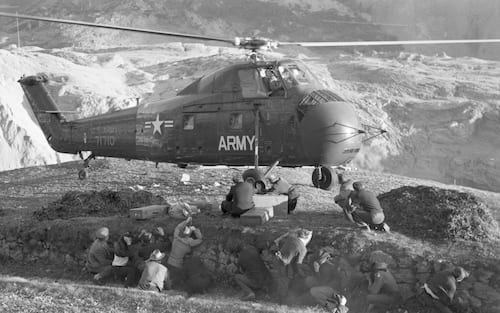 A US Army helicopter takes off full of evacuated refugees, Longarone, near the Vajont Dam in the Piave Valley, Italy, early October, 1963. On October 9, a landslide in the dam basin caused a wave more than 800 feet high to overtop the dam and flood the valley below--five villages were completely destroyed, more than 2000 people were killed, and thousands more were left homeless and displaced. (Photo by Archivio Cameraphoto Epoche/Getty Images)