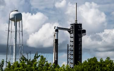 A SpaceX Falcon 9 rocket with the Crew Dragon Resilience capsule sits on Launch Complex 39A at Kennedy Space Center ahead of the Polaris Dawn Mission due to launch on August 27 at the Kennedy Space Center in Florida, on August 26, 2024. The mission crew will carry out the first ever private spacewalk. (Photo by CHANDAN KHANNA / AFP) (Photo by CHANDAN KHANNA/AFP via Getty Images)