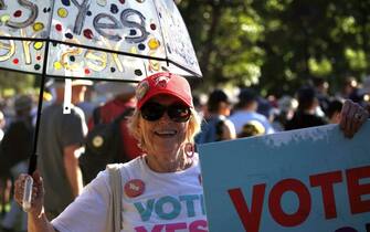 A person takes part in a "Walk for Yes" rally in Sydney on September 17, 2023. Thousands joined "Walk for Yes" events in major cities, ahead of the referendum that could grant Indigenous Australians a constitutionally enshrined right to be consulted on policies that affect them -- a "Voice to Parliament". (Photo by Andrew LEESON / AFP) (Photo by ANDREW LEESON/AFP via Getty Images)