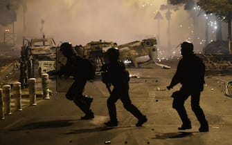 epa10718287 Riot police clash with protesters in Nanterre, near Paris, France, 29 June 2023. Violence broke out after police fatally shot a 17-year-old during a traffic stop in Nanterre on 27 June 2023. According to the French interior minister, 31 people were arrested with 2,000 officers being deployed to prevent further violence.  EPA/JULIEN MATTIA