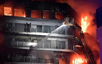 Firefighters battle a huge fire raging through a multistorey residential block in Valencia on February 22, 2024. (Photo by Jose Jordan / AFP) (Photo by JOSE JORDAN/AFP via Getty Images)