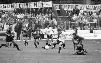 Merthyr Tydfil's Dave Webley comes under pressure from the Italian defence during the European Cup Winners' Cup first-round match against Atalanta at Penydarren Park.   (Photo by PA Images via Getty Images)