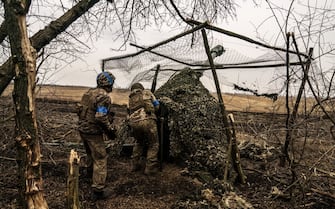 ADIIVKA, DONETSK OBLAST, UKRAINE - MARCH 13: Ukrainian soldiers at the artillery position in an unidentified area on the Adiivka frontline prepare to fire the D 30 gun as the war between Russia and Ukraine continues in Adiivka, Donetsk Oblast, Ukraine on March 13, 2024. (Photo by Jose Colon/Anadolu via Getty Images)