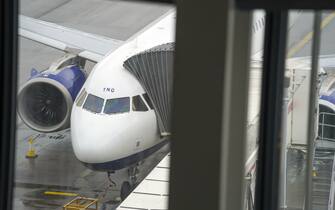 A British Airways plane sits at a gate in Terminal 5 at Heathrow Airport in west London ahead of international travel restarting on Monday May 17, following the further easing of lockdown restrictions. Picture date: Thursday May 13, 2021.