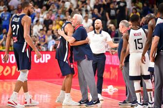 DONGGUAN, CHINA - SEPTEMBER 11: Nicolas Batum #5 of France and Head Coach Gregg Popovich of USA hug after the game during the 2019 FIBA World Cup Quarter-Finals on September 11, 2019 at the Dongguan Basketball Center in Dongguan, China. NOTE TO USER: User expressly acknowledges and agrees that, by downloading and/or using this photograph, user is consenting to the terms and conditions of the Getty Images License Agreement. Mandatory Copyright Notice: Copyright 2019 NBAE (Photo by David Dow/NBAE via Getty Images)