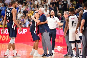 DONGGUAN, CHINA - SEPTEMBER 11: Nicolas Batum #5 of France and Head Coach Gregg Popovich of USA hug after the game during the 2019 FIBA World Cup Quarter-Finals on September 11, 2019 at the Dongguan Basketball Center in Dongguan, China. NOTE TO USER: User expressly acknowledges and agrees that, by downloading and/or using this photograph, user is consenting to the terms and conditions of the Getty Images License Agreement. Mandatory Copyright Notice: Copyright 2019 NBAE (Photo by David Dow/NBAE via Getty Images)