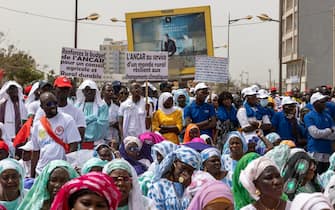 epa12067280 Activists take part in a Labor Day rally in Dakar, Senegal, 01 May 2025. Labor Day, or May Day, is observed worldwide on 01 May to celebrate the economic and social achievements of workers, as well as to fight for laborers' rights.  EPA/JEROME FAVRE
