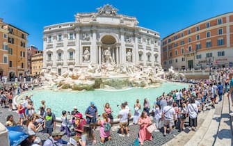 Rome, Italy - Trevi Fountain surrounds by tourists
