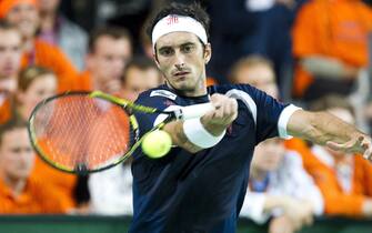 Italian Potito Starace returns a ball to Dutch Robin Haase during the Davis cup match in Zoetermeer, the Netherlands, on May 7, 2010. AFP PHOTO/ANP/KOEN SUYK netherlands out - belgium out (Photo credit should read KOEN SUYK/AFP via Getty Images)