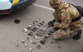 epa11261903 Evidence is secured by a military expert at the scene of an overnight shelling attack in Kharkiv, northeastern Ukraine, 06 April 2024, amid the Russian invasion. At least six people were killed and ten wounded in the rocket and drone attacks, according to a report by the Kharkiv Military Administration. Russian troops entered Ukrainian territory on 24 February 2022, starting a conflict that has provoked destruction and a humanitarian crisis.  EPA/SERGEY KOZLOV