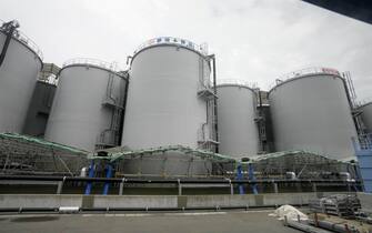 epa10760358 The storage tanks of the radioactive water treated by the Advanced Liquid Processing System (ALPS) are lined at Tokyo Electric Power Company's (TEPCO) Fukushima Daiichi Nuclear Power Plant in Futaba, Fukushima Prefecture, northern Japan, 21 July 2023, during a press tour to get hint when the TEPCO and Japanese government will start to release the radioactive water treated by the Advanced Liquid Processing System (ALPS) this summer. The nuclear power plant is located in tsunami-devastated towns of Okuma and Futaba.  EPA/KIMIMASA MAYAMA / POOL