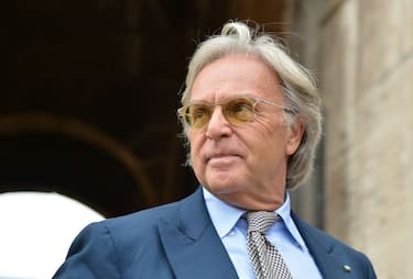 Diego Della Valle, founder and chief executive of luxury shoe company Tod's, poses in front of the Colosseum before a press conference on July 29, 2014 in Rome. Della Valle sponsor Italy's effort to restore the 2,000 year old Roman Colosseum. AFP PHOTO / ALBERTO PIZZOLI        (Photo credit should read ALBERTO PIZZOLI/AFP via Getty Images)