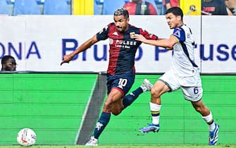 Genoa’s Brazilian forward Junior Messias (left) and Hellas Verona's French midfielder Reda Belahyane during the Italian Serie A soccer match Genoa Cfc vs Hellas Verona Fc at Luigi Ferraris stadium in Genoa, Italy, 1 September 2024. ANSA/STRINGER