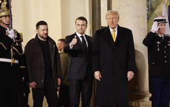 epaselect epa11762659 French President Emmanuel Macron (C), US president-elect Donald J. Trump (R) and Ukrainian President Volodymyr Zelensky (L) leave Elysee Palace to attend the reopening ceremony of the Notre Dame de Paris Cathedral, in Paris, France, 07 December 2024. The Notre-Dame de Paris Cathedral reopens on 07 December after nearly six years of renovation work following its destruction by a fire on 15 April 2019.  EPA/MOHAMMED BADRA
