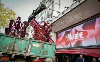 Workers remove the wings of the Moulin Rouge cabaret in Paris on April 25, 2024, after it collapsed last evening. The wings of the windmill on top of the famous Moulin Rouge cabaret fell off during the night on Wednesday the Paris fire department said. No injuries were reported, they said, adding that there was no longer any risk of further collapse. The reasons for the fall are currently unknown. It caused damage to the front of the cabaret, bringing down with it the first three letters of the illuminated sign. Images on social media showed the blade unit lying on the street below, with some of the blades slightly bent from the apparent fall. Photo by Firas Abdullah/ABACAPRESS.COM