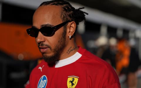 epa12464986 Scuderia Ferrari driver Lewis Hamilton of Britain enters the paddock before the start of the 2025 Formula 1 United States Grand Prix at the Circuit of the Americas racetrack in Austin, Texas, USA, 19 October 2025.  EPA/DUSTIN SAFRANEK