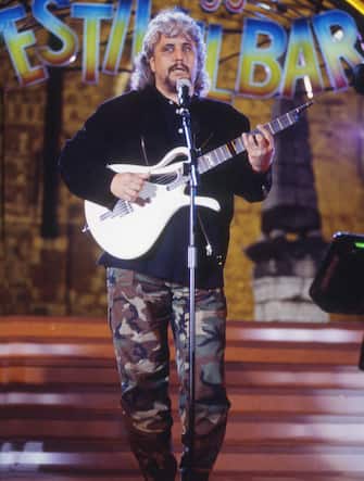 The Italian singer-songwriter Pino Daniele sings and plays the guitar at Festivalbar. Italy, summer 1995 (Photo by Rino Petrosino/Mondadori Portfolio via Getty Images)