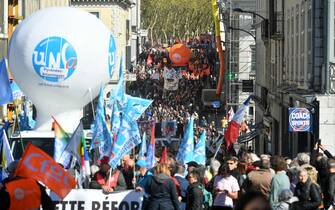 Protestors march as they take part on the 11th day of action after the government pushed a pensions reform through parliament without a vote, using the article 49.3 of the constitution, in Pau, southwestern France on April 6, 2023. - France on April 6, 2023 braced for another day of protests and strikes to denounce French President's pension reform one day after talks between the government and unions ended in deadlock. (Photo by GAIZKA IROZ / AFP)