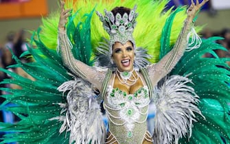 RIO DE JANEIRO, BRAZIL - MARCH 03: A member of Imperio Serrano Samba School gesturest during their parade at 2019 Brazilian Carnival at Sapucai Sambadrome on March 03, 2019 in Rio de Janeiro, Brazil. Rio's two nights of Carnival parades began today in a burst of fireworks and to the cheers of thousands of tourists and locals who have previously enjoyed street celebrations (known as 'blocos de rua') all around the city. (Photo by Buda Mendes/Getty Images)