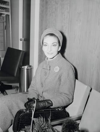 (Original Caption) Opera star arrives...Maria Callas, opera star, arrives at Idlewild for her concert tour of the United States. She holds flowers presented by the airline and has a toy French Poodle on a leash.