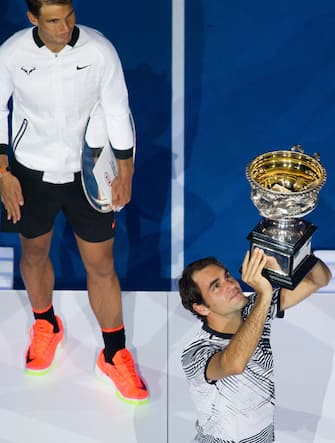 (170129) -- MELBOURNE, Jan. 29, 2017 (Xinhua) -- Roger Federer (R) of Switzerland holds the trophy during the trophy presentation after winning the men's singles final match against Rafael Nadal of Spain at the Australian Open tennis championships in Melbourne, Australia, Jan. 29, 2017. Federer won 3-2. (Xinhua/Bai Xue) 
****Authorized by ytfs****



 
 (Photo by Xinhua/Sipa USA)
