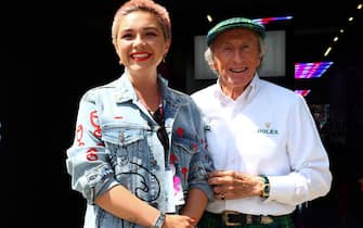 NORTHAMPTON, ENGLAND - JULY 09: Florence Pugh and Sir Jackie Stewart pose for a photo in the Paddock prior to the F1 Grand Prix of Great Britain at Silverstone Circuit on July 09, 2023 in Northampton, England. (Photo by Dan Istitene - Formula 1/Formula 1 via Getty Images)