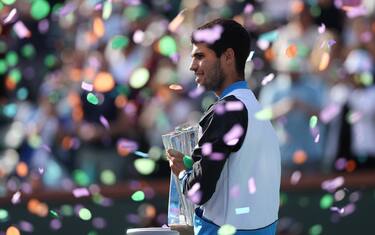 INDIAN WELLS, CALIFORNIA - MARCH 17: Carlos Alcaraz of Spain poses with the trophy after defeating Daniil Medvedev of Russia during the Men's Final of the BNP Paribas Open at Indian Wells Tennis Garden on March 17, 2024 in Indian Wells, California. (Photo by Matthew Stockman/Getty Images)