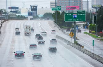 epa11467487 Cars travel through heavy rain from Hurricane Beryl in Houston, Texas, USA, 08 July 2024. The storm, which already caused widespread damage last week in the Caribbean, was downgraded to a tropical storm as it passed over the Gulf of Mexico before regaining strength into a hurricane.  EPA/CARLOS RAMIREZ