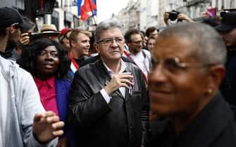 epa11591148 Leader of the left-wing party La France Insoumise (LFI) Jean-Luc Melenchon (C) attends a protest rally in Paris, France, 07 September 2024 as the French left parties called for rallies against President Macron's politics. Protests are taking place across France over the appointment of Michel Barnier as the new French prime minister, after the election that resulted in a National Assembly without a majority and in which the left won the largest number of seats.  EPA/YOAN VALAT