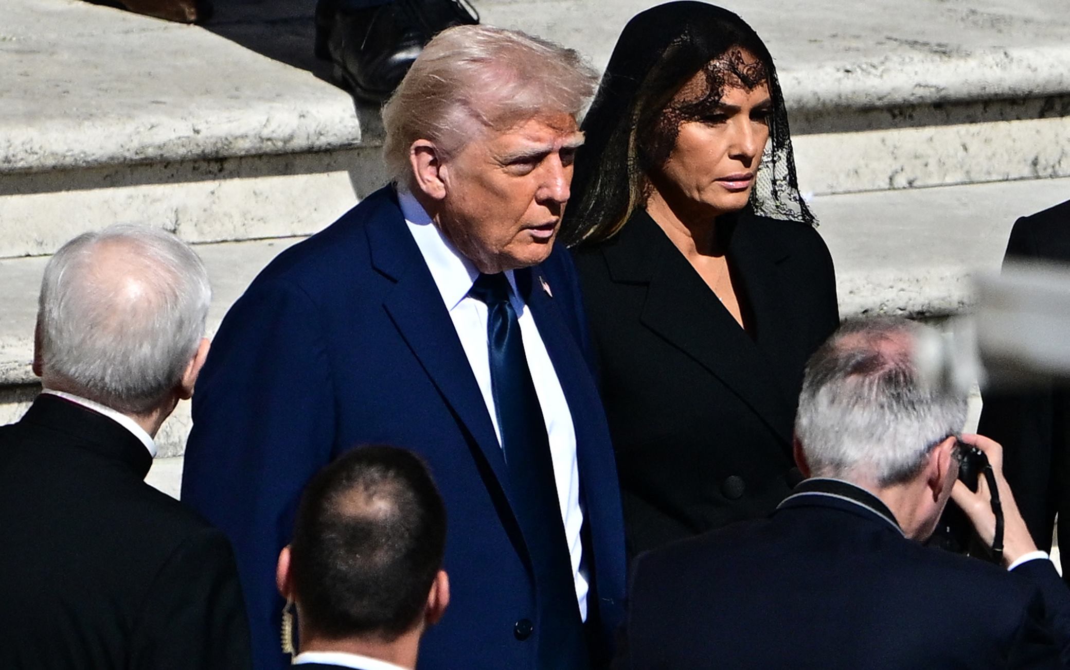 TOPSHOT - US President Donald Trump and US First Lady Melania Trump arrive ahead of the late Pope Francis' funeral ceremony at St Peter's Square at The Vatican on April 26, 2025. (Photo by Tiziana FABI / AFP) (Photo by TIZIANA FABI/AFP via Getty Images)          