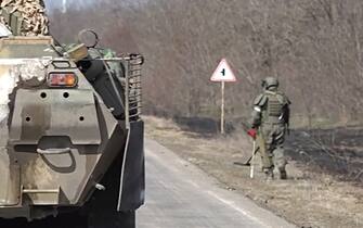 KHERSON REGION, UKRAINE – MARCH 23, 2022: A serviceman of Russian engineer units demines local farmalnds, with more than 12,000 explosives already defused. The Russian Armed Forces currently carry out a special military operation in Ukraine. Russian Defence Ministry/TASS/Sipa USA