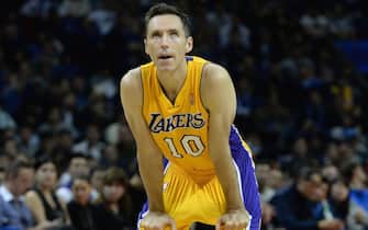 SHANGHAI, CHINA - OCTOBER 18: Steve Nash #10 of the Los Angeles Lakers looks on against the Golden State Warriors during the 2013 Global Games on October 18, 2013 at the Mercedes-Benz Arena in Shanghai, China. NOTE TO USER: User expressly acknowledges and agrees that, by downloading and/or using this photograph, user is consenting to the terms and conditions of the Getty Images License Agreement.  Mandatory Copyright Notice: Copyright 2013 NBAE (Photo by Noah Graham/NBAE via Getty Images)