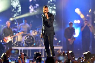 MILAN, ITALY - OCTOBER 24: Marco Mengoni performs on stage at the Milan Music Week World Stage ahead of the MTV EMA's 2015 at Piazza Duomo on October 24, 2015 in Milan, Italy.  (Photo by Anthony Harvey/MTV 2015/Getty Images)