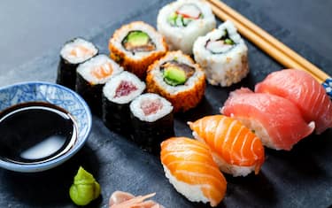 Salmon and tuna sushi on black slate plate