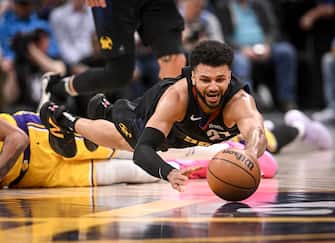 DENVER, CO - APRIL 22: Jamal Murray (27) of the Denver Nuggets dives for a loose ball after LeBron James (23) of the Los Angeles Lakers coughed it up and it slid through the fingers of Anthony Davis (3) during the fourth quarter of the Nuggets' 101-99 win at Ball Arena in Denver on Monday, April 22, 2024. (Photo by AAron Ontiveroz/The Denver Post)
