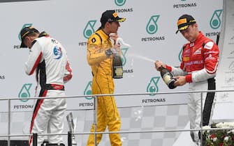 Race winner Alexander Albon (THA) ART Grand Prix, Jack Aitken (GBR) Arden International and Charles Leclerc (MON) ART Grand Prix celebrate on the podium with the champagne at GP3 Series, Rd8, Sepang, Malaysia, 30 September - 2 October 2016.