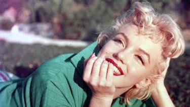 PALM SPRINGS, CA - 1954: Actress Marilyn Monroe poses for a portrait laying on the grass in 1954 in Palm Springs, California. (Photo by Baron/Hulton Archive/Getty Images)