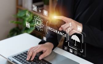 Businessman using laptop with AI tech auto insurance service concept, travel insurance data management, fast solve problem, service, digital transformation, protection, digital application.