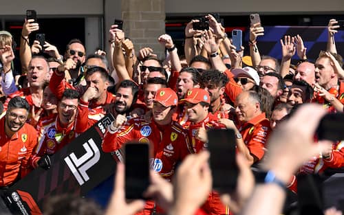 Oct 20, 2024; Austin, Texas, USA; Scuderia Ferrari driver Charles Leclerc (16) of Team Monaco and Scuderia Ferrari driver Carlos Sainz (55) of Team Spain celebrate with their team after the 2024 Formula One US Grand Prix at Circuit of the Americas. Mandatory Credit: Jerome Miron-Imagn Images/Sipa USA