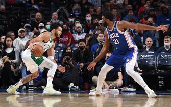 PHILADELPHIA, PA - JANUARY 14: Jayson Tatum #0 of the Boston Celtics handles the ball against Joel Embiid #21 of the Philadelphia 76ers on January 14, 2022 at Wells Fargo Center in Philadelphia, Pennsylvania. NOTE TO USER: User expressly acknowledges and agrees that, by downloading and/or using this Photograph, user is consenting to the terms and conditions of the Getty Images License Agreement. Mandatory Copyright Notice: Copyright 2021 NBAE (Photo by David Dow/NBAE via Getty Images) 