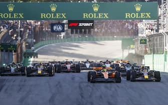 AUTÃ³DROMO JOSÃ© CARLOS PACE, BRAZIL - NOVEMBER 04: Lando Norris, McLaren MCL60, leads Max Verstappen, Red Bull Racing RB19, Sergio Perez, Red Bull Racing RB19, Sir Lewis Hamilton, Mercedes F1 W14, George Russell, Mercedes F1 W14, Charles Leclerc, Ferrari SF-23, and the rest of the field at the start of the Sprint race during the Brazilian GP at AutÃ³dromo JosÃ© Carlos Pace on Saturday November 04, 2023 in Sao Paulo, Brazil. (Photo by Andy Hone / LAT Images)