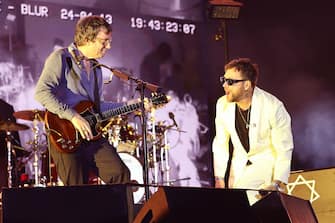 INDIO, CALIFORNIA - APRIL 13: (FOR EDITORIAL USE ONLY) (L-R) Graham Coxon and Damon Albarn of Blur perform at the Coachella Stage during the 2024 Coachella Valley Music and Arts Festival at Empire Polo Club on April 13, 2024 in Indio, California. (Photo by Arturo Holmes/Getty Images for Coachella)